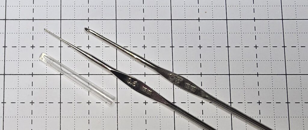 Elizabeth is showing you what a steel crochet hooks look like