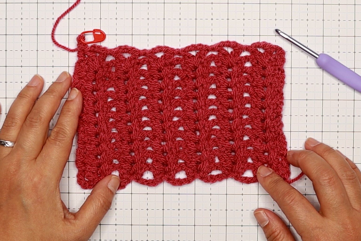Beth is showing a sample tension pattern of the ribbed v-stitch