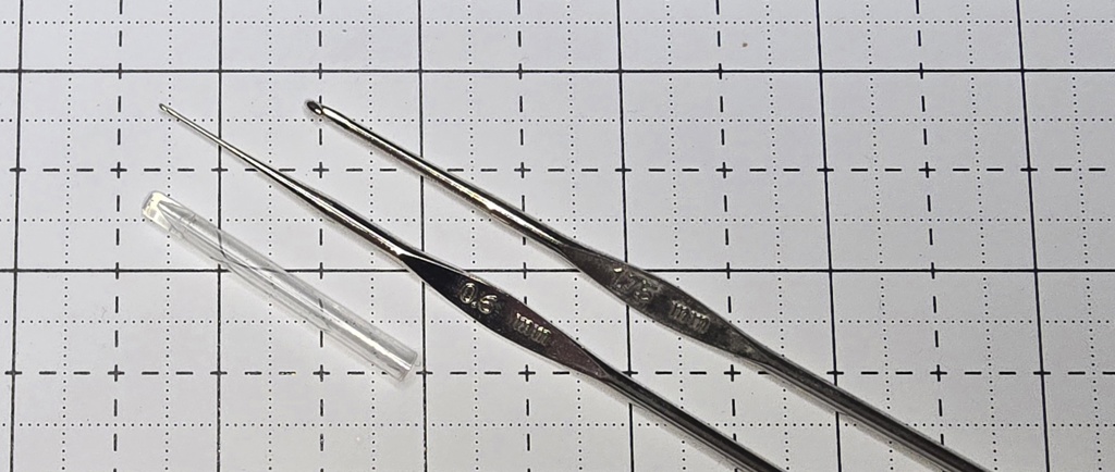 Elizabeth is showing you what a steel crochet hooks look like