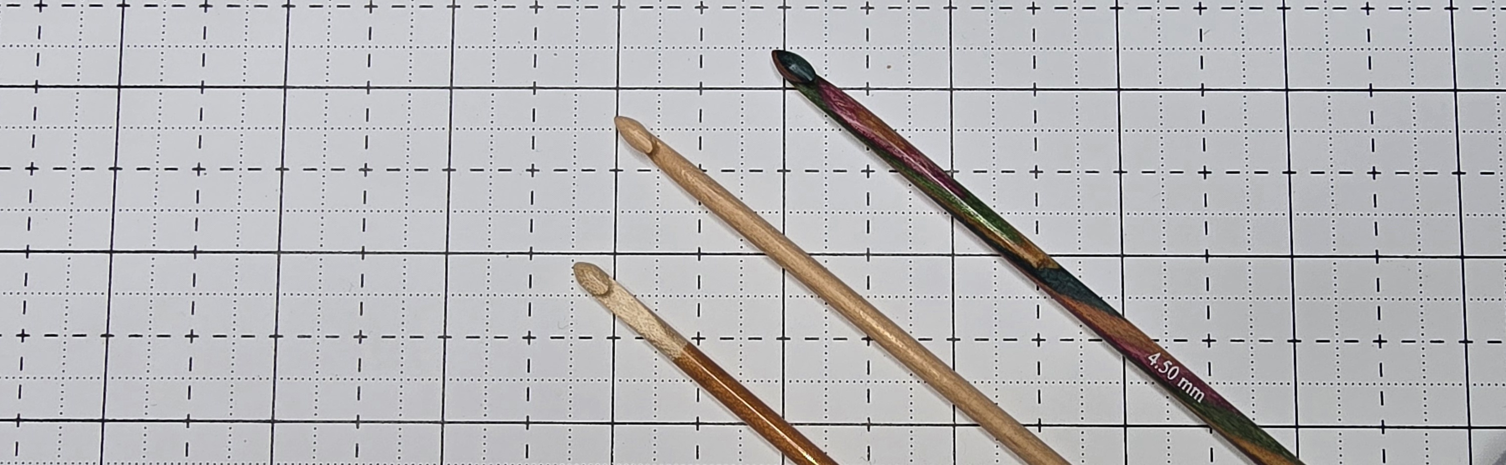 Elizabeth is showing you crochet hooks can be made of other wooden materials other than bamboos